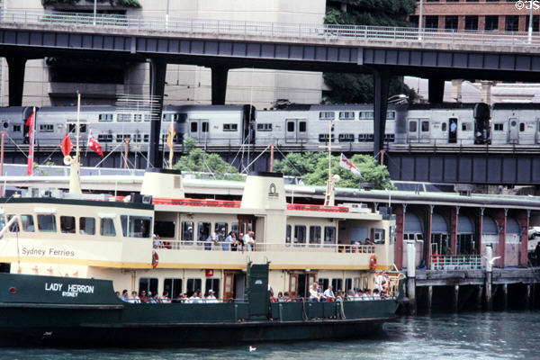 Sydney Ferries boat & commuter train on Sydney Harbour. Sydney, Australia.