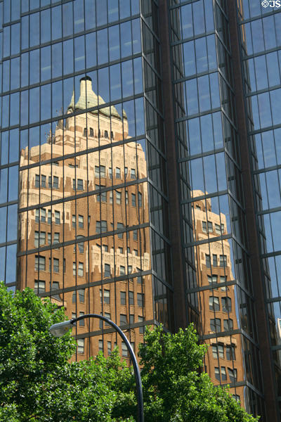 Marine Building reflected in modern glass skyscraper. Vancouver, BC.