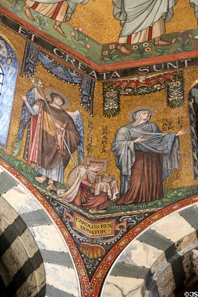 Plaque integrated into mosaics stating that they were donated by Charlemagne (aka Emperor Charles the Great) in Palatine Chapel at Aachen Cathedral. Aachen, Germany.