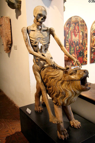 Death riding a lion sculpture once part of a clock (1513) from Kloster Heilsbronn at Bavarian National Museum. Munich, Germany.