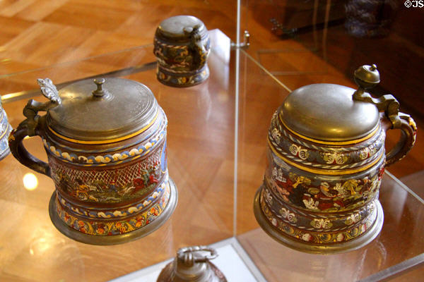 Stoneware humpens with tin lids painted with hunting scene (c1700) at Coburg Castle. Coburg, Germany.