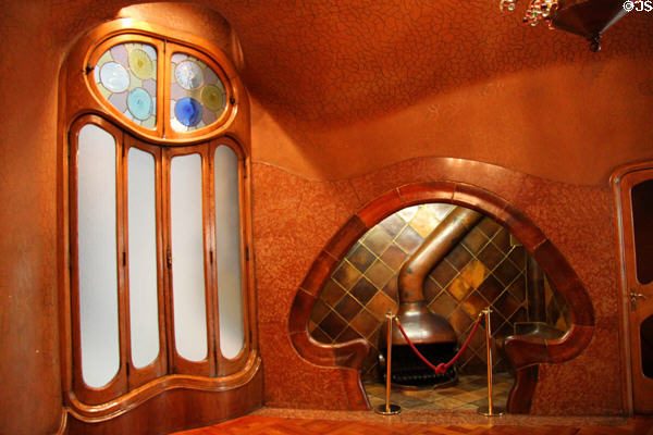 Window beside cubby hole sitting area around fireplace at Casa Batlló. Barcelona, Spain.