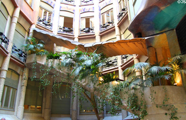 Staircase crosses central courtyard of Casa Milà. Barcelona, Spain.