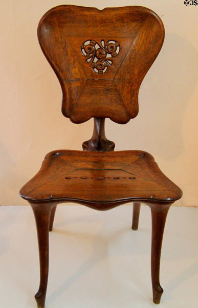 Modernista chair (c1900) designed for Casa Calvet in Barcelona by Antoni Gaudí at Gaudi House Museum in Parc Güell. Barcelona, Spain.