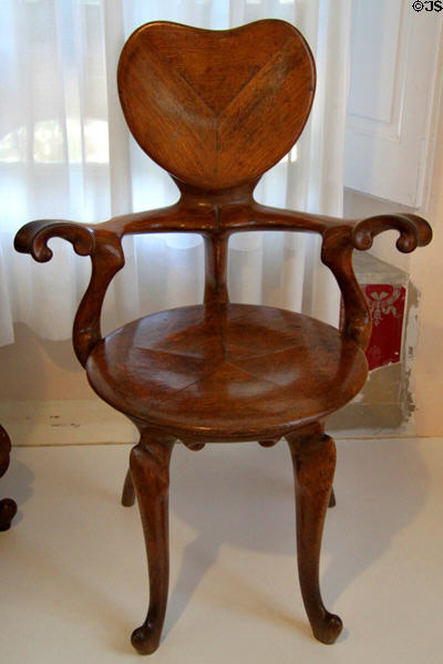 Modernista armchair (c1900) designed for Casa Calvet in Barcelona by Antoni Gaudí at Gaudi House Museum in Parc Güell. Barcelona, Spain.