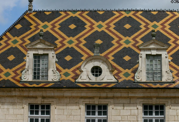 St Louis facade & tiled roof in courtyard of Hotel Dieu. Beaune, France.