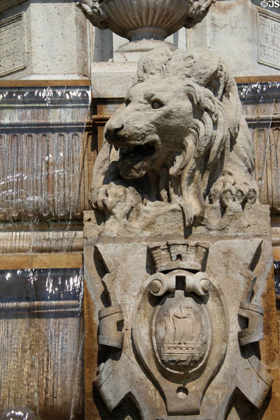 Lion statue over shield of city of Paris on St-Sulpice fountain. Paris, France.