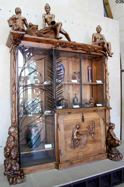 Bookcase (1890) by François-Ruper Carabin at Musée d'Orsay. Paris, France.