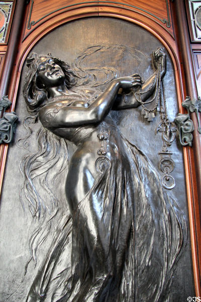 Detail of Art Nouveau figure holding jewelry (1901) designed by Alphonse Mucha on front of jewelry store Boutique Fouquet at Carnavalet Museum. Paris, France.