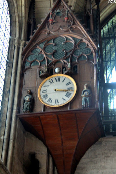 Clock with holy figures on pedestal in Reims Cathedral. Reims, France.