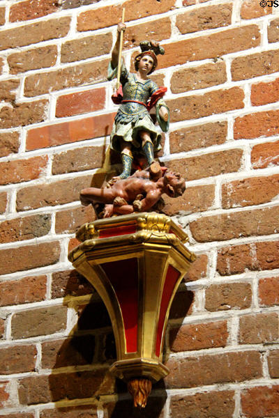 Statue of St Michael Slaying the Dragon (17thC) from Spain in Franciscan Antechamber in Royal Lodge at Chateau Royal of Amboise. Amboise, France.