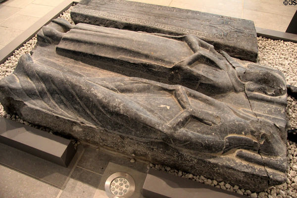 Tombstones carved with figures in prayer at Medieval Mile Museum. Kilkenny, Ireland.