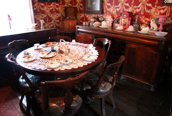 Dining table & sideboard in Golden Vale Farmhouse at Bunratty Castle & Folk Park. County Clare, Ireland.