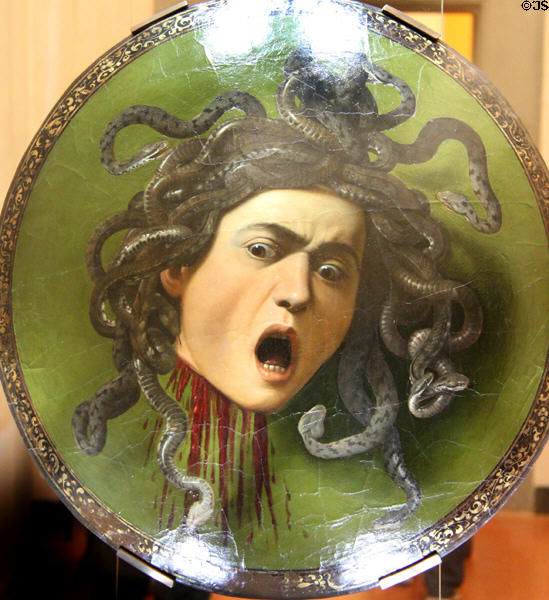 Head of Medusa parade shield (c1597) by Caravaggio (aka Michelangelo Merisi) at Uffizi Gallery. Florence, Italy.