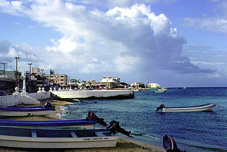 Buildings & boats docked on shore of Cozumel. Mexico.