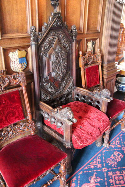 Carved great armchair with lion handles in dining room at Glamis Castle. Angus, Scotland.