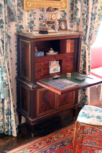 Meissen porcelain clock on French writing desk by Stockel in Woodcock bedroom at Cawdor Castle. Cawdor, Scotland.