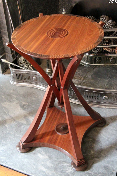 Round wooden table supported by unique struts in dining room at Duff House. Banff, Scotland.