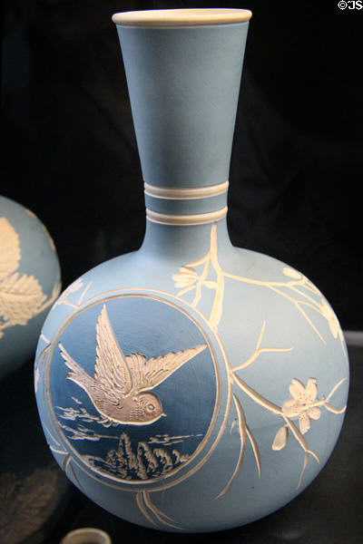 Salopian bottle vase incised with bird in flight in roundel on dark blue�background (c1901-25) by Benthall Pottery at Jackfield Tile Museum. Ironbridge, England.