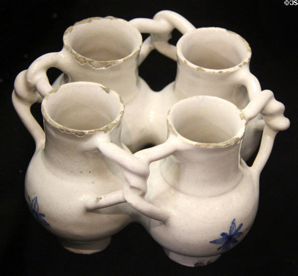 Tin-glazed earthenware fuddling cup (mid 17thC) made in Lambeth, London at Potteries Museum & Art Gallery. Hanley, Stoke-on-Trent, England.
