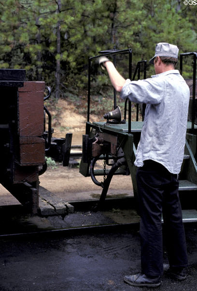 Coupling cars at Yosemite Mountain-Sugar Pine Railroad. Fish Camp, CA.