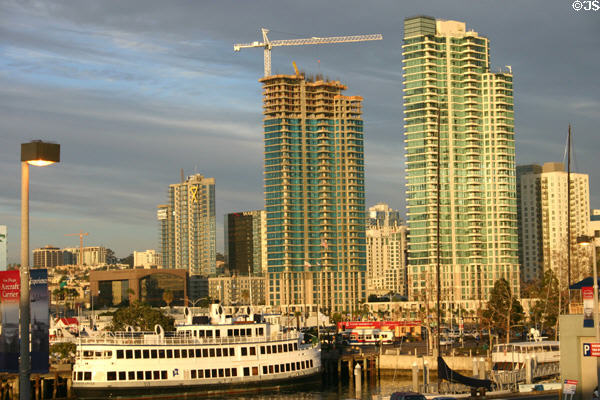 Two green The Grande towers (2003-5) from Midway dock with Lord Hornblower ship. San Diego, CA.