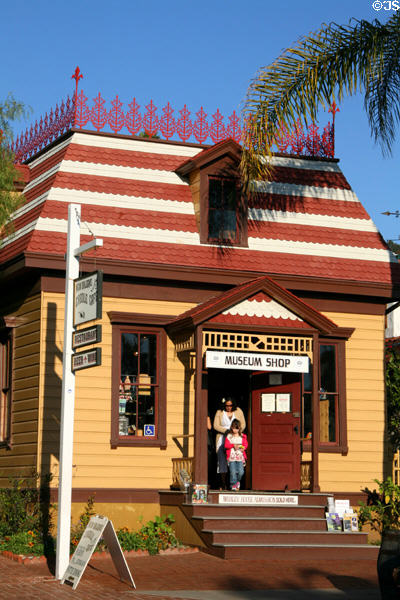 Heritage house with cast iron roof railing serves as museum shop on grounds of Whaley House in Old Town. San Diego, CA.
