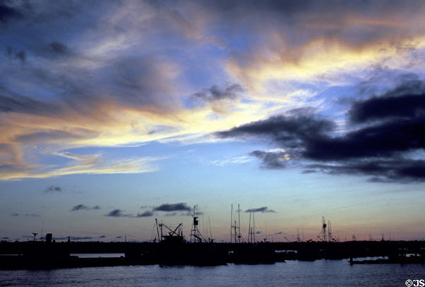Clouds reflect sunset over San Diego Harbor. San Diego, CA.