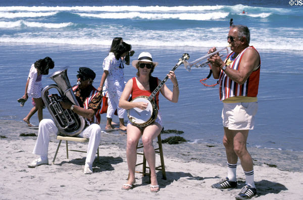 Dixieland trio plays at sand sculpting contest on Coronado Island beach. San Diego, CA.