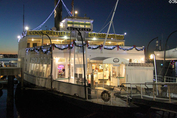 Passenger Ferry Berkeley at Maritime Museum outlined in lights. San Diego, CA.