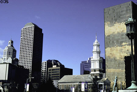 Gold One Financial Plaza (1975) (26 floors) (755 Main St.) towers over First Church of Christ. Hartford, CT. Architect: CB Richard Ellis-N.E. Partners.