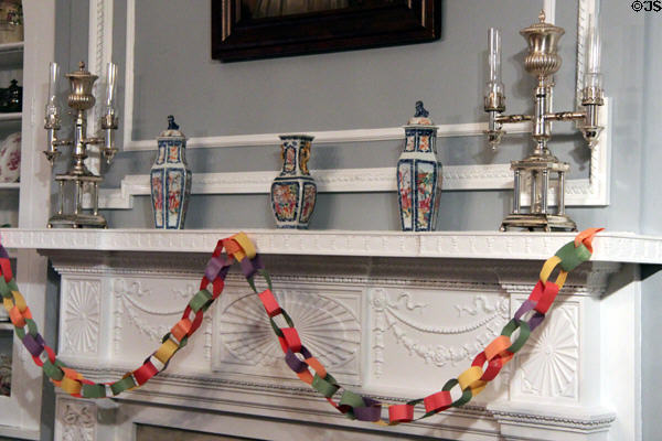 Fireplace mantle with Chinese export vase set (1735-96) & pair of two-arm oil lamps in Ohio period parlor at DAR Memorial Continental Hall. Washington, DC.