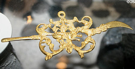 Gold ear pick with dog motif recovered from Spanish ship wreck off Florida at Historical Museum of Southern Florida. Miami, FL.