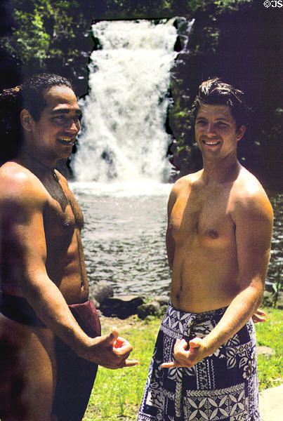 Pair of high rock divers at Waimea Valley Adventure Park. Oahu, HI.
