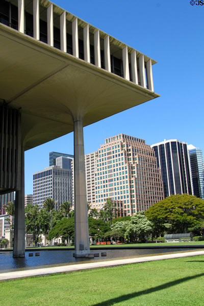 Alii Place & black Pauahi Tower framed by Hawaii state legislature building. Honolulu, HI.