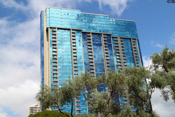 Blue glass facade of Capitol Place. Honolulu, HI.