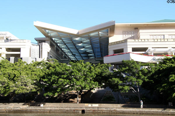 Covered arcade of Hawaii Convention Center meets Ala Wai Canal. Honolulu, HI.