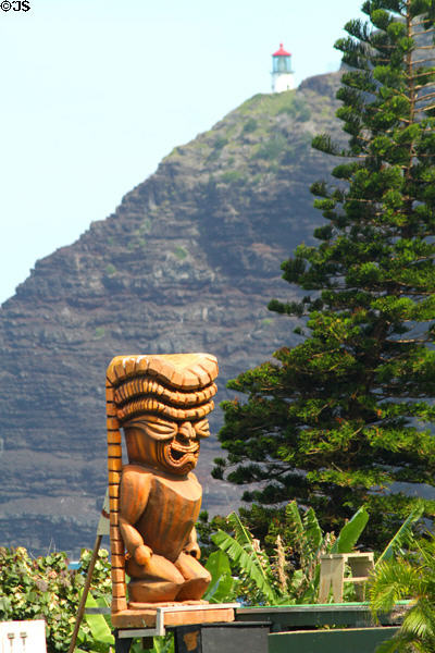Tiki at Sea Life Park with Makapu'u Lighthouse. HI.