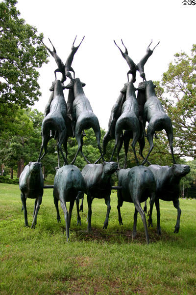 Sculpture of deer on back of other deer beside Des Moines Art Center. Des Moines, IA.