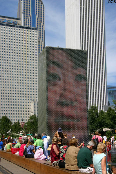 Crown Fountain tower in Millennium Park seen against surrounding skyscrapers. Chicago, IL.