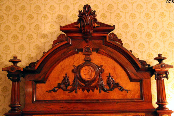 Headboard carvings of Cleopatra on Benjamin Harrison's bed at Benjamin Harrison Presidential Site. Indianapolis, IN.
