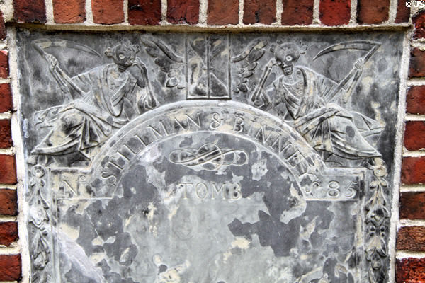 Tombstone with grim reapers & hourglass at Granary Burying Ground. Boston, MA.
