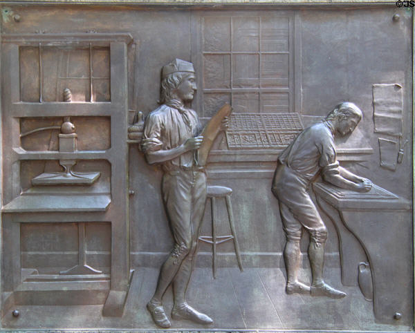 Bronze relief on base of Benjamin Franklin statue of Franklin learning art of printing. Boston, MA.