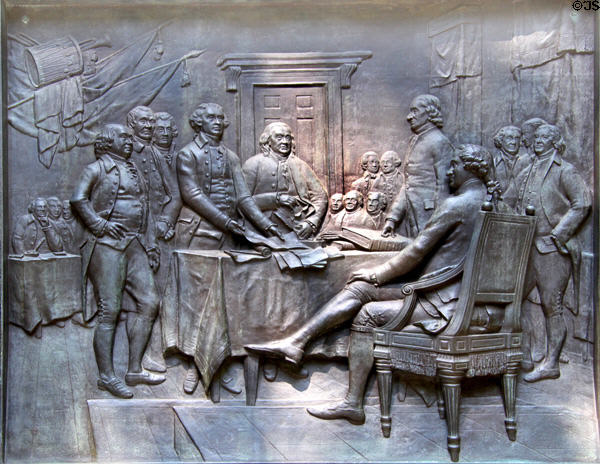 Bronze relief on base of Benjamin Franklin statue of Franklin at the signing of the Declaration of Independence. Boston, MA.