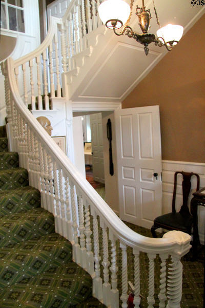 Staircase with spiral newel post & twisted rope balusters in main entrance hall at Longfellow National Historic Site. Cambridge, MA.