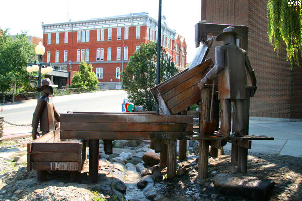 The Prospectors sculpture (1974) of gold miners sluicing ore by Lyndon Pomeroy on Last Chance Gulch Mall at Broadway. Helena, MT.