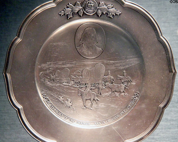 USS New Mexico ship's silver service (1917) with scene of Santa Fe trail at New Mexico History Museum. Santa Fe, NM.