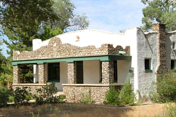 Paseo del Pueblo Norte house faced with stones. Taos, NM.