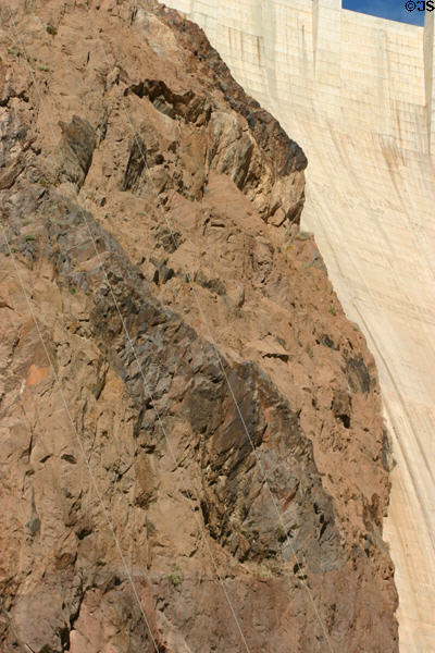 Concrete Hoover Dam meets rock of Black Canyon of Colorado River. Las Vegas, NV.
