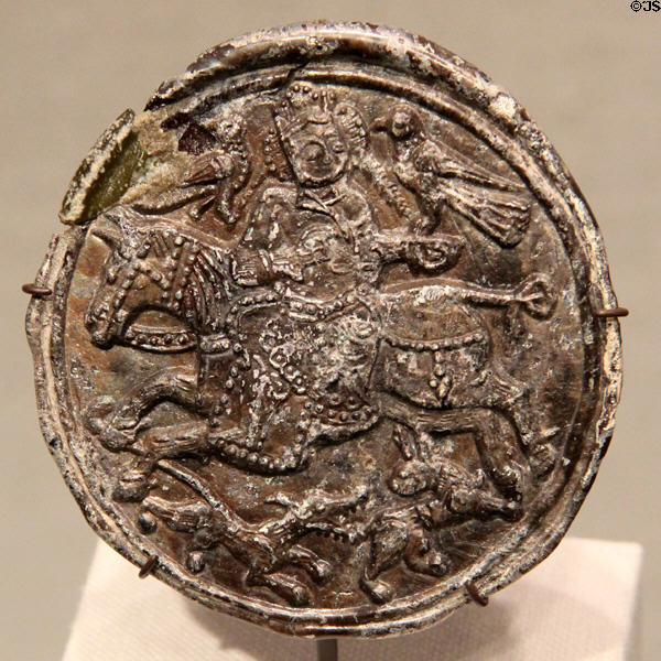 Islamic glass medallion with falconer (12thC) at Corning Museum of Glass. Corning, NY.